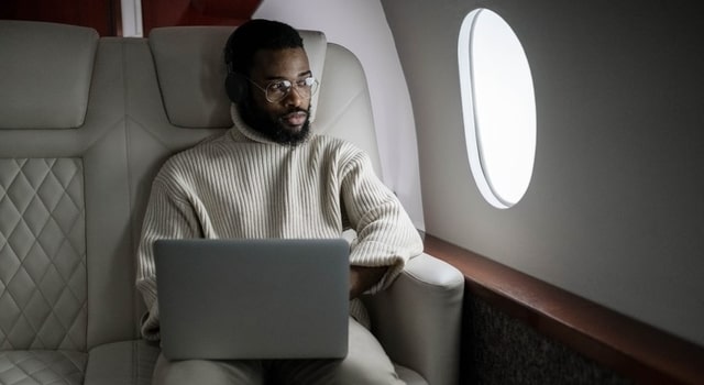 man looking out the airplane window 640×350 1.jpg